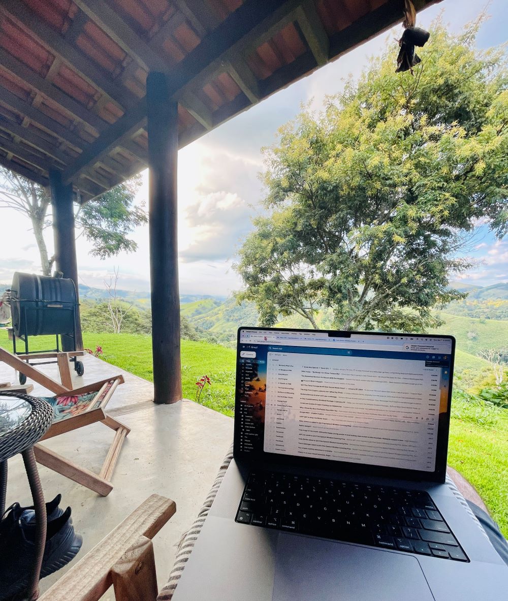 A laptop set against a stunning scenic backdrop, highlighting the blend of work and natural beauty.