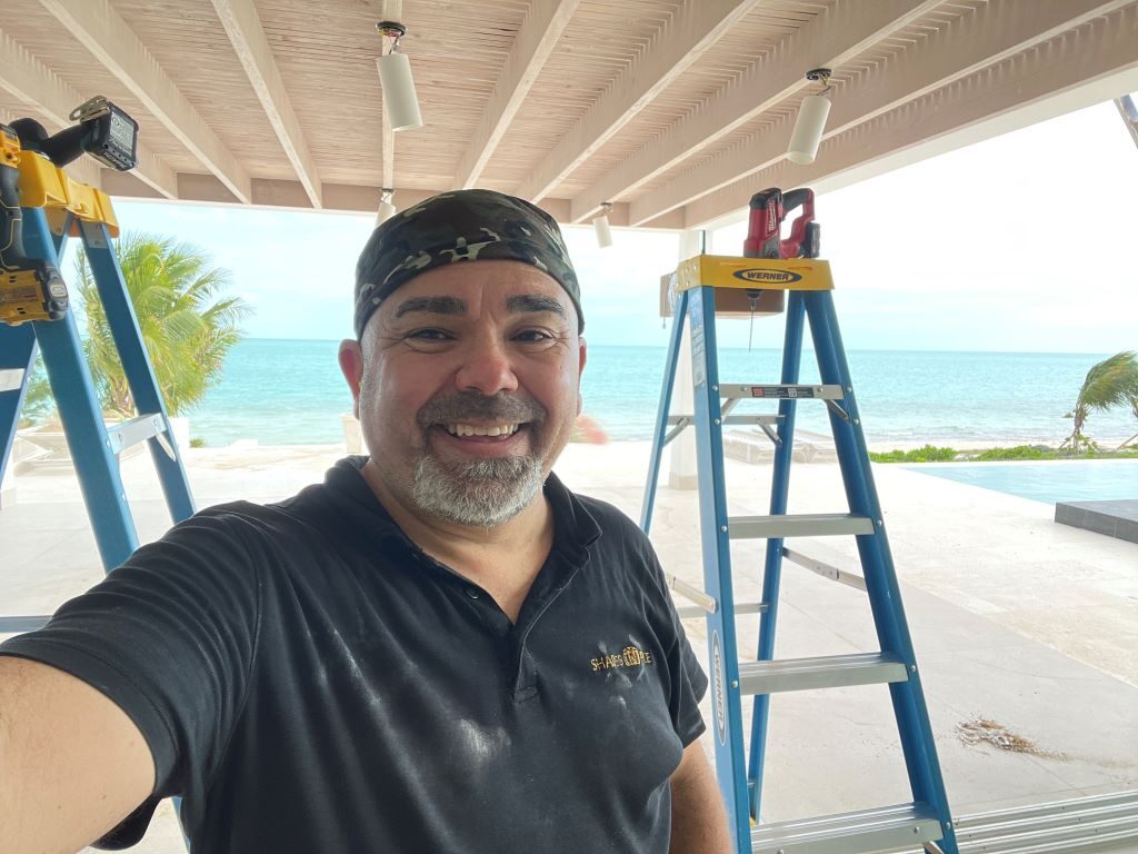 Roger Magalhaes at an installation site in Turks and Caicos