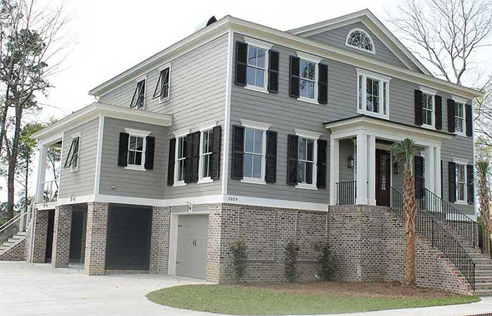 Home with black colonial shutters