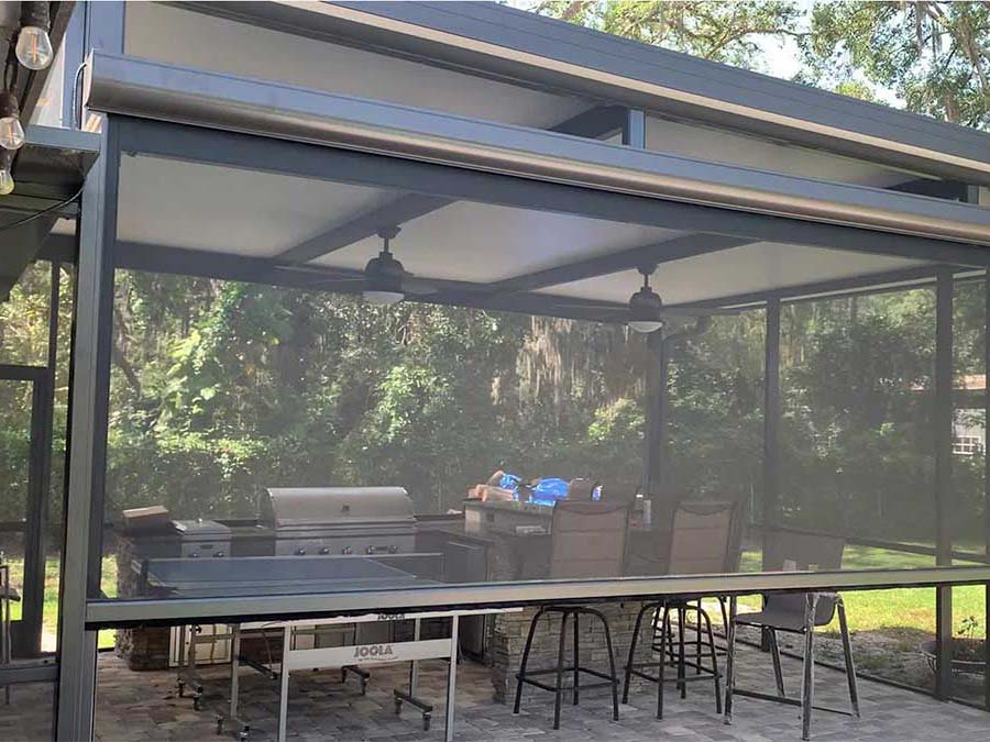 Retractable screen over grillside patio